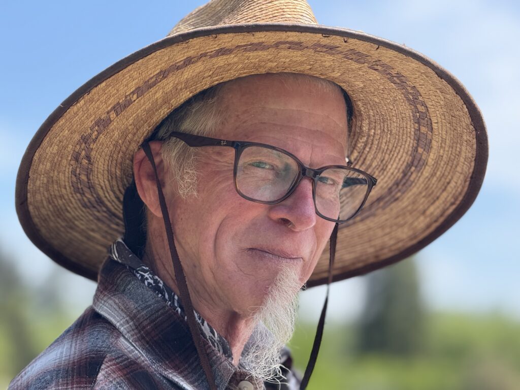 Kirk Pearson wearing a straw hat.