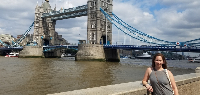 HDFS student in front of the London Bridge while studying abroad