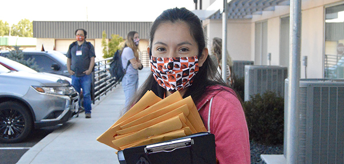 TRACE volunteer wears OSU face mask