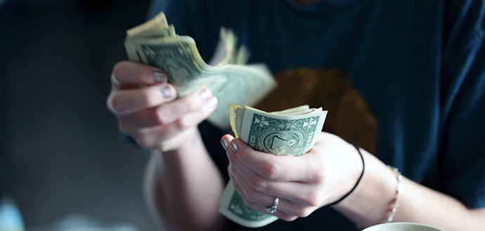 Women wearing ring handles money