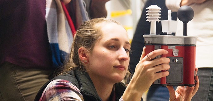 OSU graduate student conducting research in steam tunnel