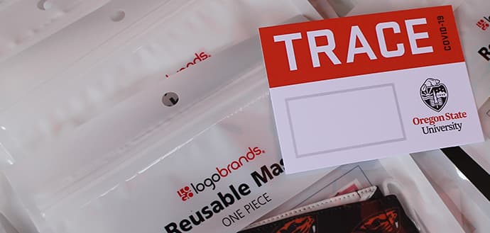 blank TRACE nametag lying on sealed reusable beaver masks