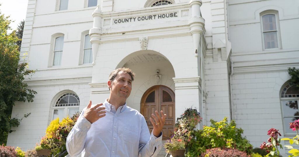 David Rothwell talks outside the Benton County Courthouse on a bright, sunny day