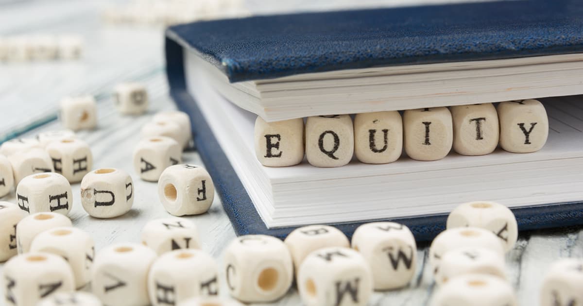 Equity spelled out in small wooden blocks