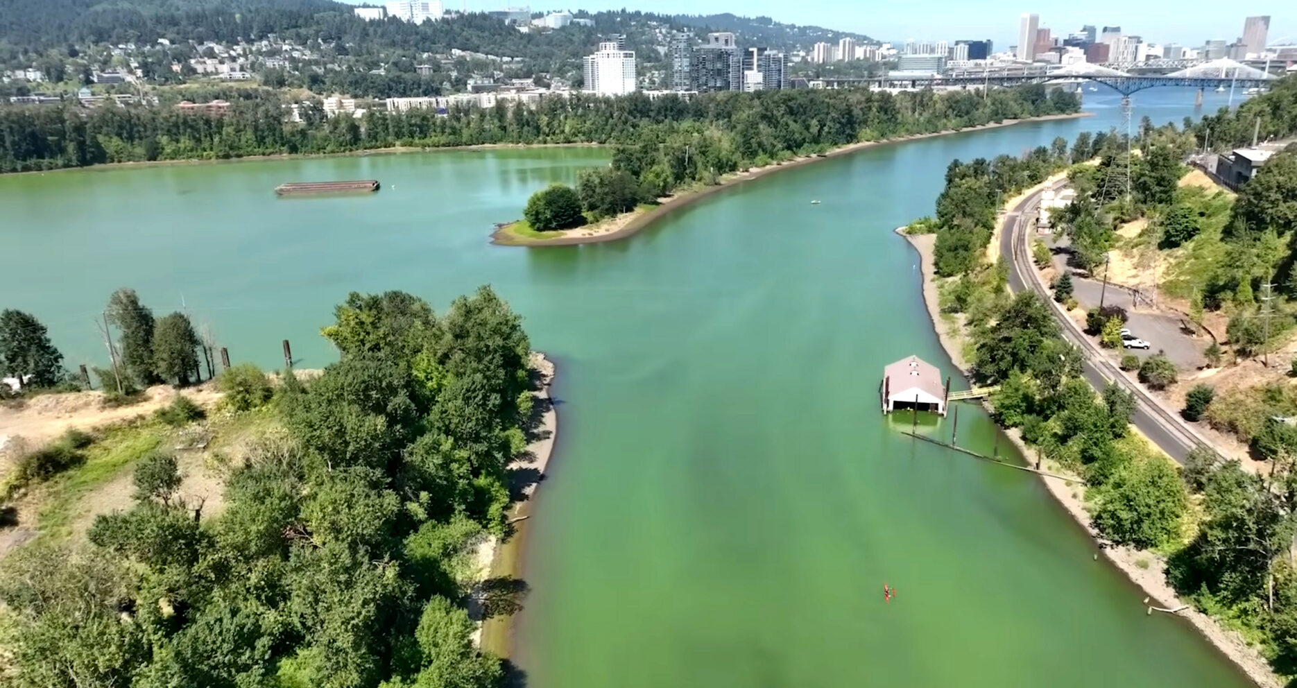 Aerial view of the Willamette River with green water.