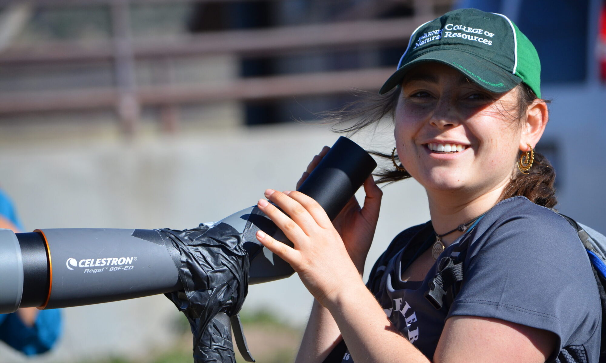 A student using binoculars