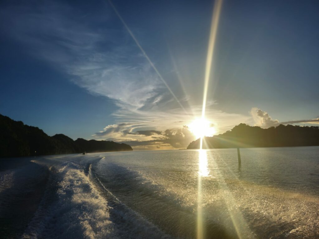 Sun Rays Peeking Out From Behind Clouds Exemplifying Hope Stock