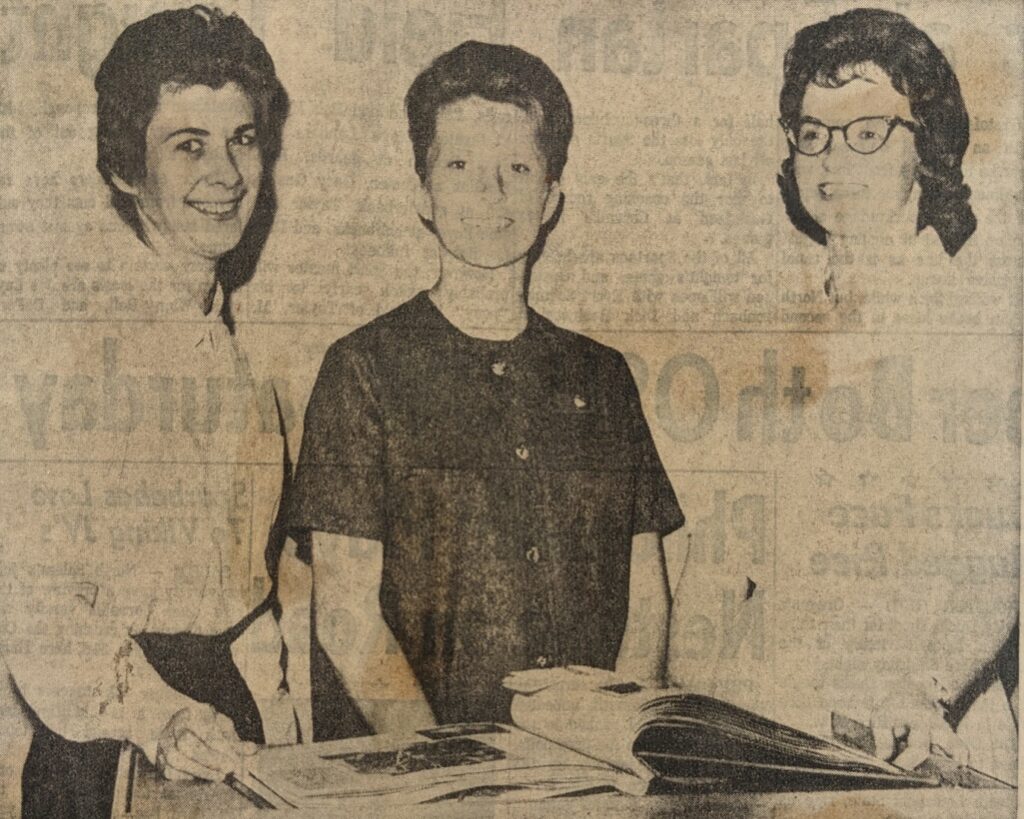 Three white women standing together in an old newspaper clipping.