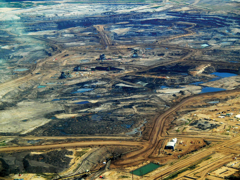 Human Impacts on the Global Carbon Cycle.  Open pit mine in the tar sands oil fields of Alberta, Canada