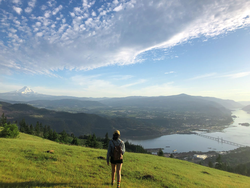 Enjoying the beautiful view at Burdoin Overlook in White Salmon Washington in May 2020. This hike had a spectacular view of Mt. Hood, the Columbia River, and grazing cows.