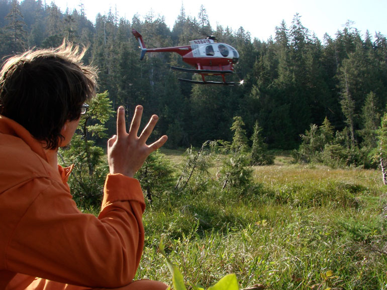 Working in the Tongass National Forest as a soil scientist, our work commute sometimes involved being helicoptered into remote areas, being dropped off in flat alpine wetlands called muskegs, to examine forests and the soils of the surrounding area. My co-worker Jerome Barner waves goodbye for the day. 