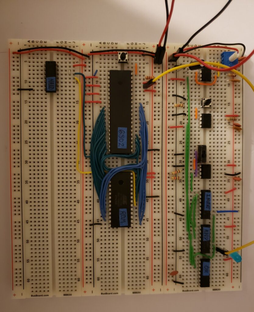 connection of 6502 processor and ROM with address (green wires)/data (blue wires) connections -- NAND gate chip on other bread board so the ROM is "normalized" to the 8000 to 8FFF range rather than the 0000-FFFF range