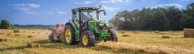 Image of a tractor bailing hay