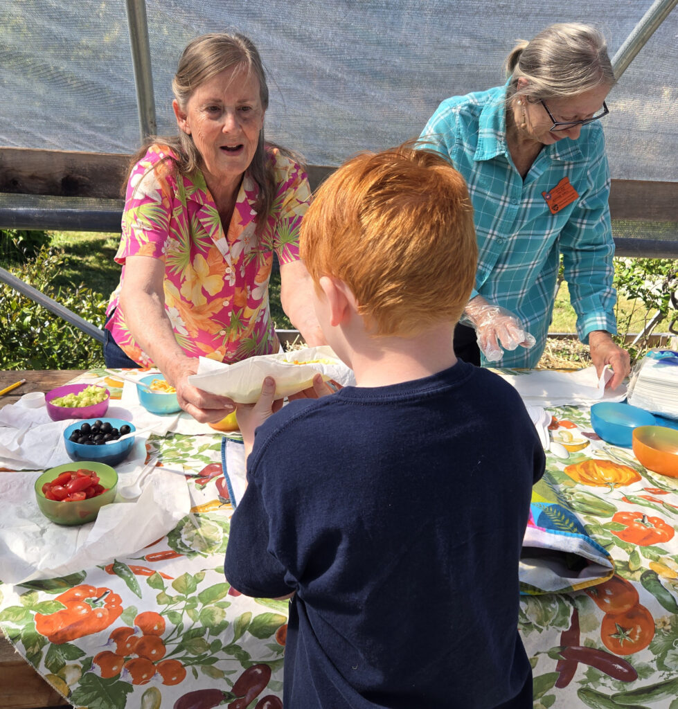 Master Gardeners Serving food to Riley Creek Elementary Students