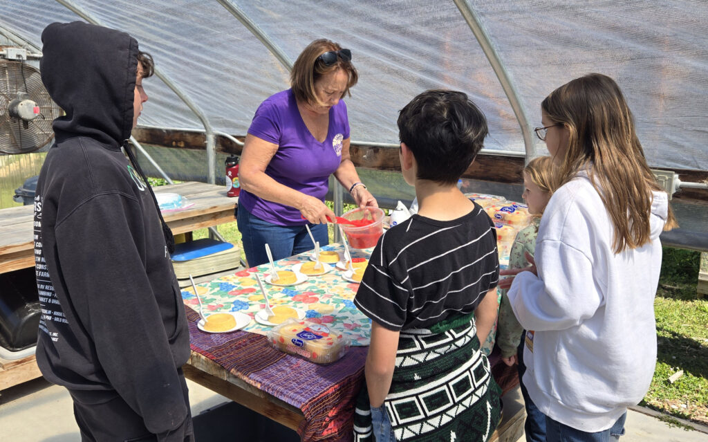 Master Gardeners Serving food to Riley Creek Elementary Students