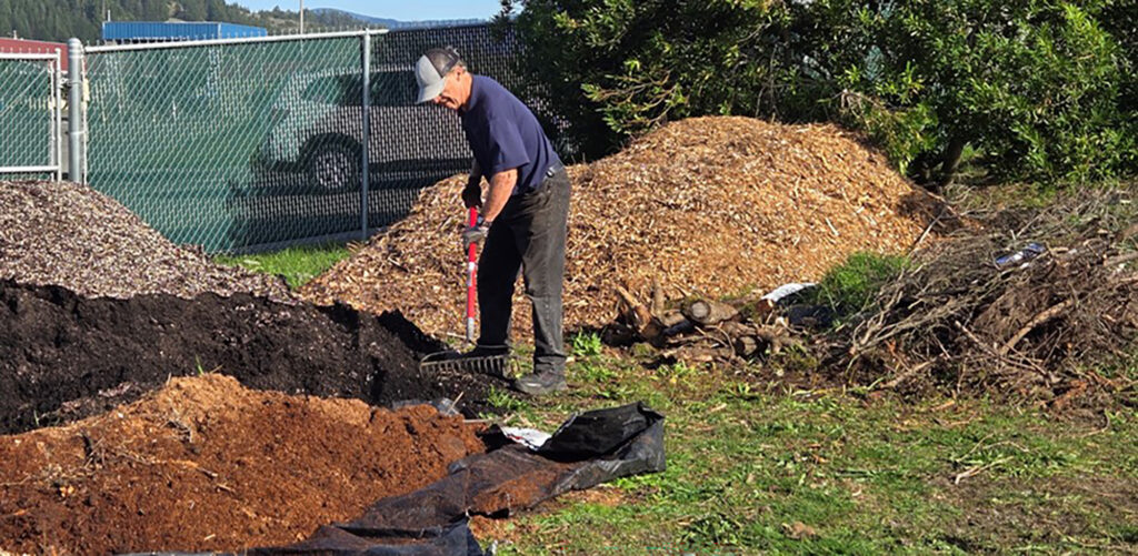 MG Volunteer prepping the soil for Hügelkultur class at Curry Educational Greenhouse and Garden