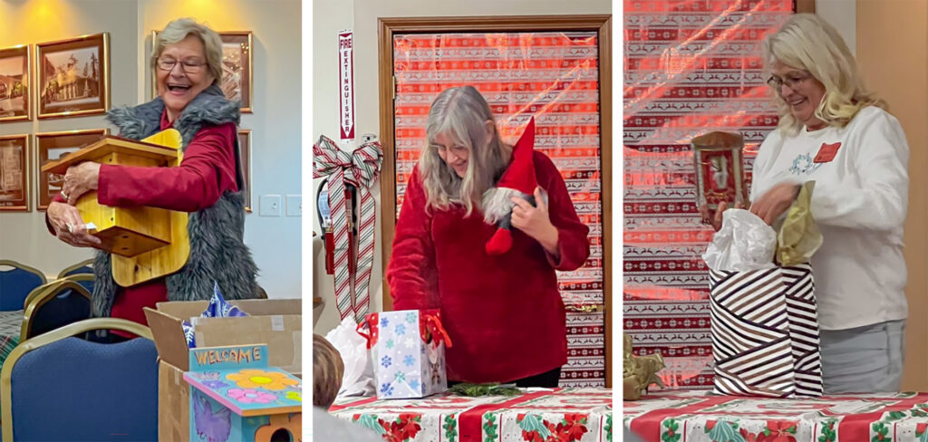 a few MG volunteers selecting their white elephant gift at the 2025 holiday party 