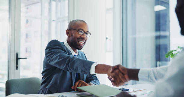 Man, business and shaking hands in office for meeting, lawyer and client in legal consultation together for agreement. Professional, negotiation and thank you gesture, partnership and opportunity Man, business and shaking hands in office for meeting, lawyer and client in legal consultation together for agreement. Professional, negotiation and thank you gesture, partnership and opportunity formal interview stock pictures, royalty-free photos & images