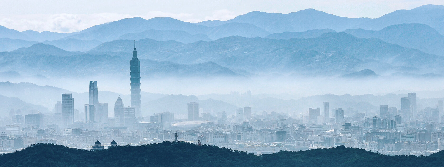 Taiwan city skyline with mountains in the back